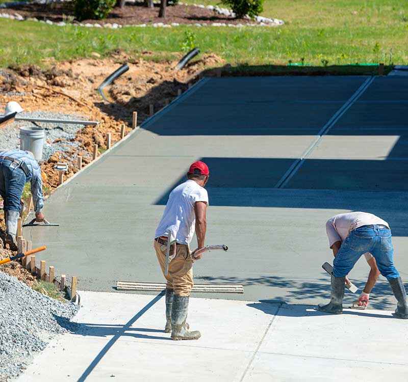 Why-Do-Clients-Choose-FerCo-Construction ferco construction contractors working on a concrete driveway